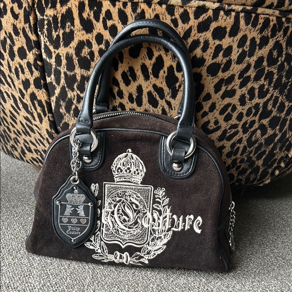Juicy Couture Black Satchel with Regal Crest Design
